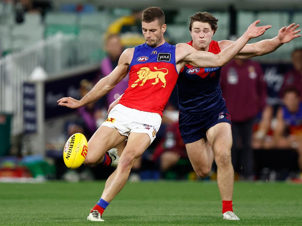 Lions star Josh Dunkley (left) evades the attention of Melbourne’s Tom Sparrow in Brisbane’s win at the MCG last week. Picture: Michael Willson/AFL Photos via Getty Images