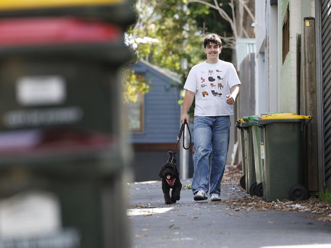 Forest Lodge resident Nicholas Lovell with his dog Whinnie. Sydney City Council is looking to change bin collection from weekly to fortnightly. Picture: Richard Dobson