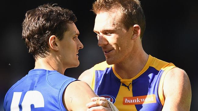 Petrie catches up with former Roos teammate Scott Thompson in Round 1. Picture: Getty Images