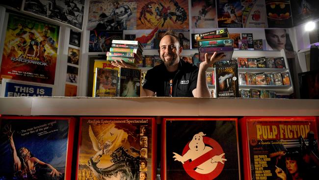 Retro film enthusiast Deniel Cross, with his collection of more than 800 VHS tapes, is opening Vicious Video. Picture: Tricia Watkinson