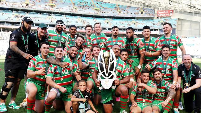 The Rabbitohs celebrate victory with the NRL State Championship trophy. Photo by Matt King/Getty Images.