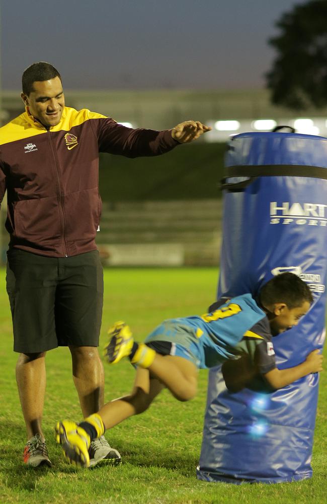 The North Lakes Kangaroos junior Brian Pouniu on the tackling pads with Broncos’ David Hala in 2014. Pic: Josh Woning.