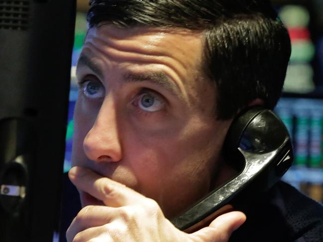 A trader studies his screen as he works on the floor of the New York Stock Exchange, Wednesday, March 30, 2016. U.S. stocks are rising Wednesday as banks and technology stocks trade higher. (AP Photo/Richard Drew)