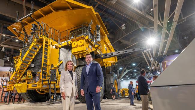 Denise Johnson, President, Resource Industries, Caterpillar Inc with Ragnar Udd from BHP in front of the Cat 798 featuring the Caterpillar Incs Cat Dynamic Energy Transfer (DET) system. Photo: Supplied