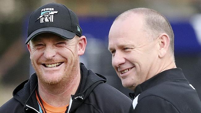 Power assistant coach Michael Voss has a laugh with Ken Hinkley. Picture Sarah Reed