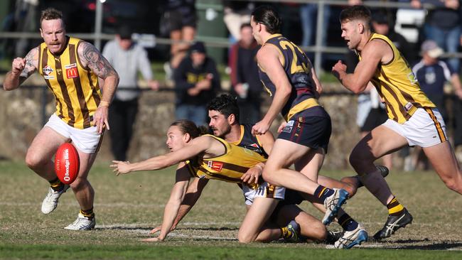 Joshua Clarke in pursuit of the ball. Picture: Stuart Milligan