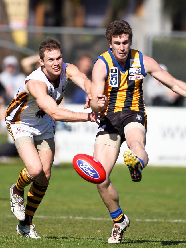 James Hallahan (right) gets his kick for Sandringham.