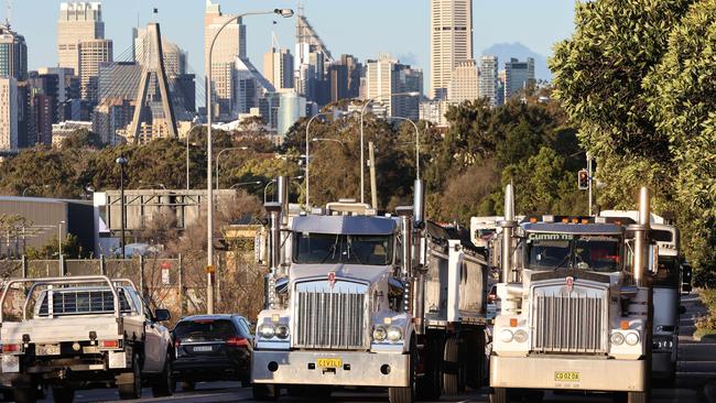 About 100 trucks drove across the Sydney Harbour Bridge and Anzac Bridge in protest against the NSW government stopping construction work until July 30. Picture: David Swift.