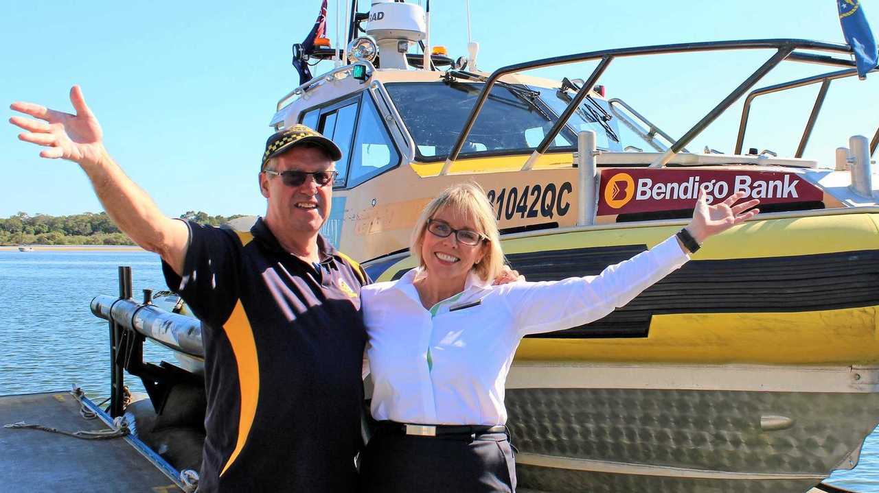 BIG WIN: Coast Guard Noosa commander Ian Hutchings and Bendigo Bank's Linda Oliver celebrating the latest funding announcement at Munna Point squadron. Picture: Contributed