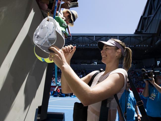 Maria Sharapova signs autographs after her win. Picture: Michael Klein