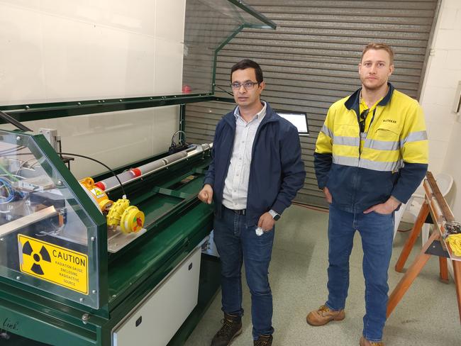 Carbon Link senior scientist Thakur Bhattarai and General Manager Chris McCosker with the Gladstone developed soil condition analysis scanner. Picture: Rodney Stevens