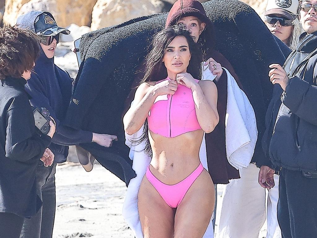 Kim Kardashian bares her butt in pink thong bikini