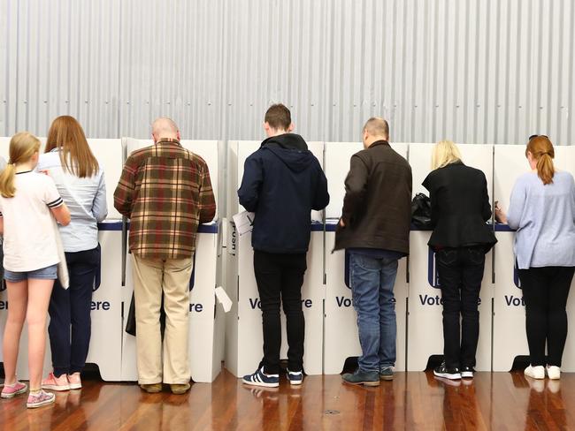 Voters casting their ballots at Mosman High.