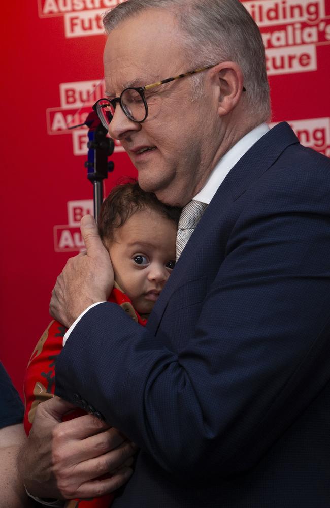 He is seen hugging a baby in a reindeer onesie. Picture: NewsWire / Glenn Campbell