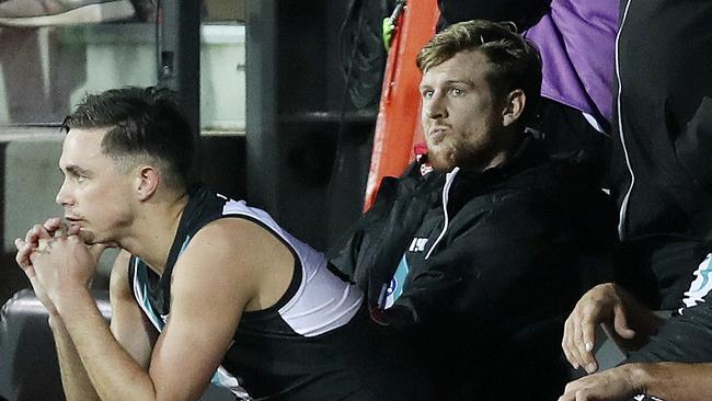 Port Adelaide defender Tom Jonas ponders how much time a knee injury will keep him on the sidelines as the AFL premiership race becomes shaped by significant injuries to key players. Picture: Sarah Reed