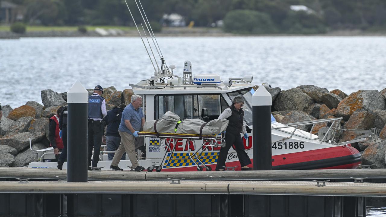The recovered body of a passenger on the capsized boat is collected from Sea Rescue at Billy Lights Point Boat Ramp at Port Lincoln Picture Mark Brake