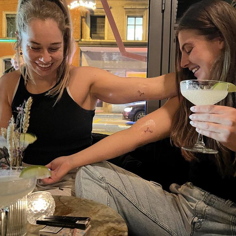 Apps and Sergis compare their matching margarita tattoos. Picture: Instagram