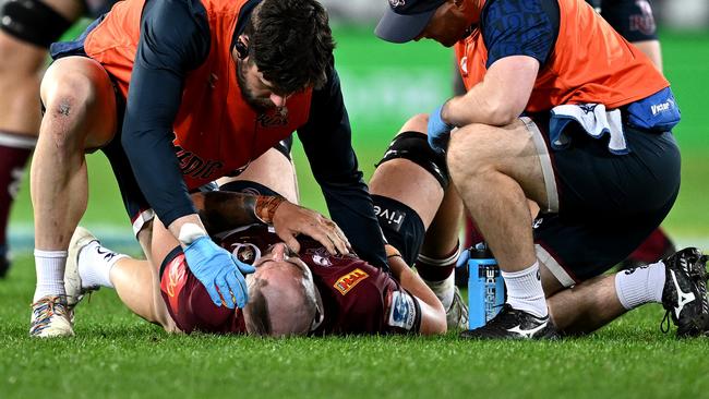 Connor Vest receives medical assistance in Dunedin. Picture: Joe Allison/Getty Images