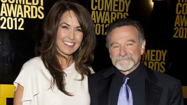 FILE - In this April 28, 2013 file photo, Robin Williams, right, and his wife Susan Schneider arrive to The 2012 Comedy Awards in New York. Schneider said Williams' medical afflictions would have claimed his life within three years _ “hard years” _ and that she doesn't blame him for his suicide. The actor-comedian had not only been diagnosed with Parkinson's disease, a progressive movement disorder, a few months before his death, but also that a coroner's report found signs of Lewy body dementia, a difficult-to-diagnose condition that leads to a decline in thinking and reasoning abilities. (AP Photo/Charles Sykes, File)