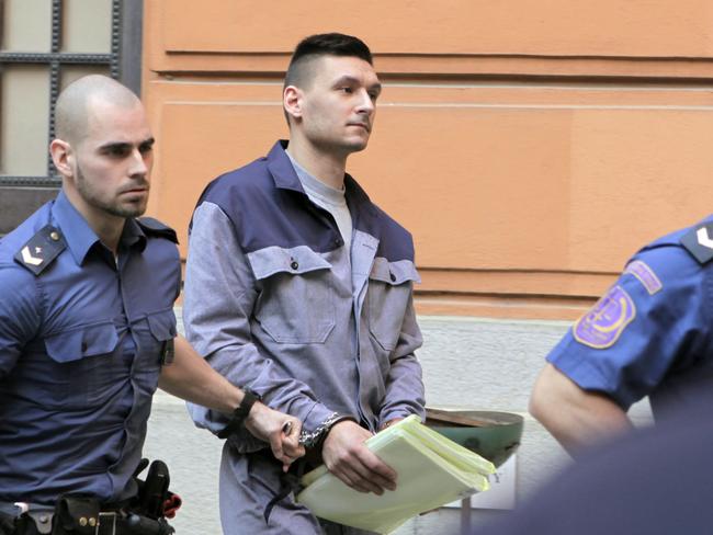 Radim Zondra, is escorted from the Regional court in Brno, Czech Republic. Picture: Monika Hlavacova/CTK via AP