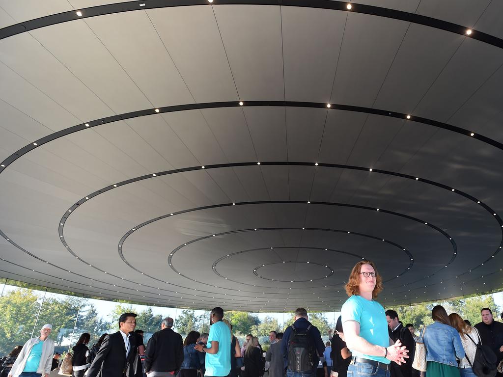 An Apple employee greets attendees as they arrive for a product launch event at Apple's headquarters in Cupertino, California. Picture: AFP