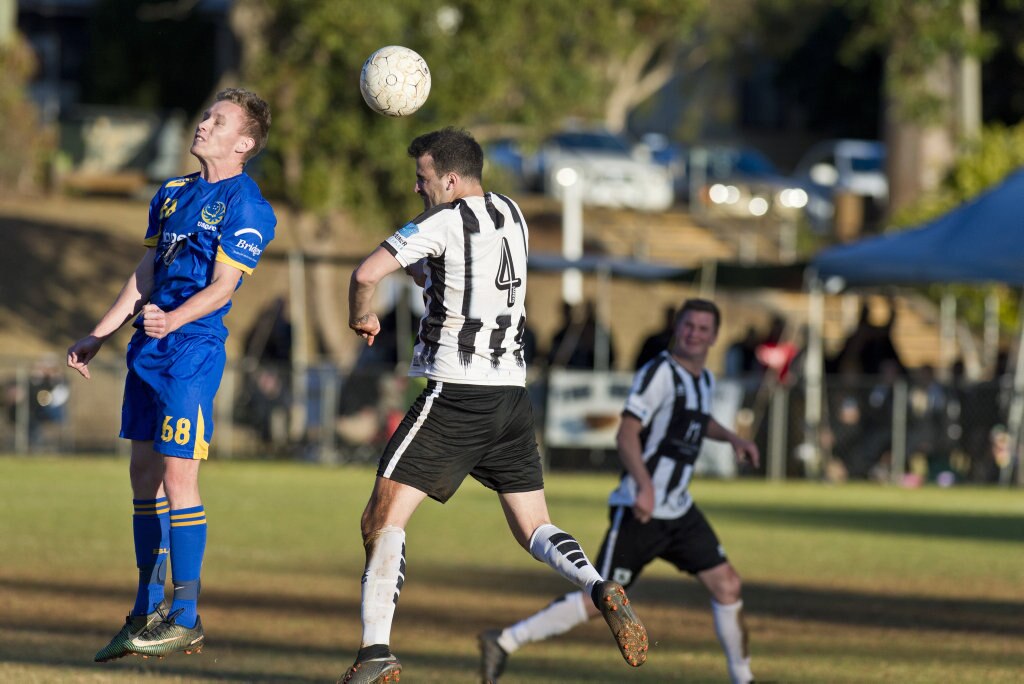 Jed Sugden (left) of USQ FC and Adam Daly of Willowburn in Toowoomba Football League Premier Men semi-final at Commonwealth Oval, Sunday, August 26, 2018. Picture: Kevin Farmer