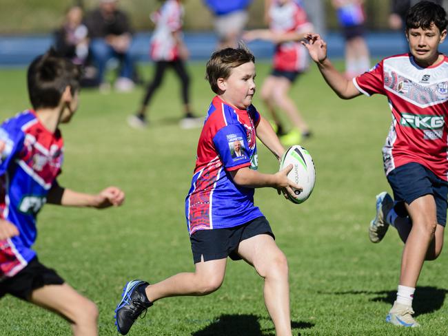 Kade Edwards with the ball for Highfields State School attempts to evade Javahn of Bunkers Hill State School in the inaugural Primary Interschools Reconciliation Touch Carnival hosted by Glenvale State School, Wednesday, May 28, 2025. Picture: Kevin Farmer