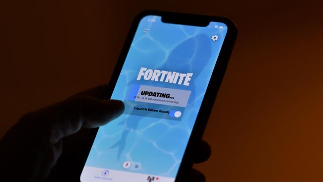 Fortnite game maker Epic accuses Apple of abuse of market power by charging 30 per cent of all money made on mobile apps and not allowing game suppliers to provide their own payments services. Picture: AFP