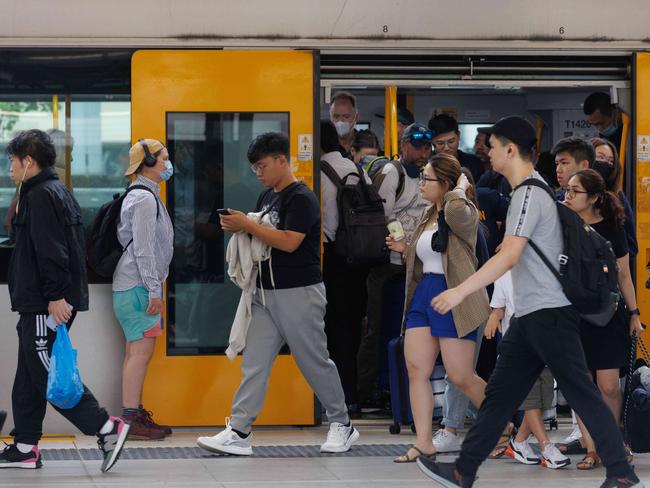 Commuters are pictured at Central Station today. Picture: David Swift