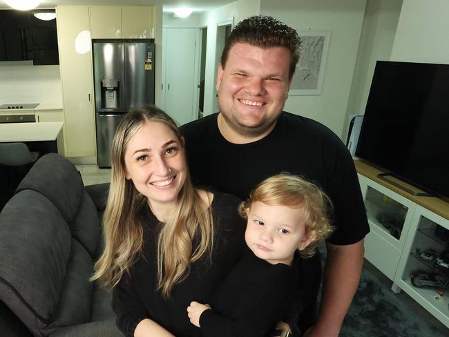 Ashlee Brooks partner Shane Scroop, with daughter Alora, 1. At their Holland Park West Apartment. Picture: Liam Kidston