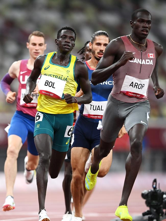 Peter Bol cruises past Marco Arop on his way to victory in his 800m semi-final. Picture: Getty Images