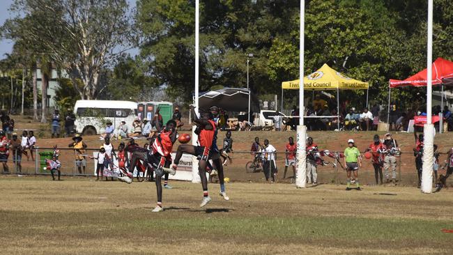 Players in action during the Tiwi Island Football League grand final between Tuyu Buffaloes and Pumarali Thunder. Picture: Max Hatzoglou