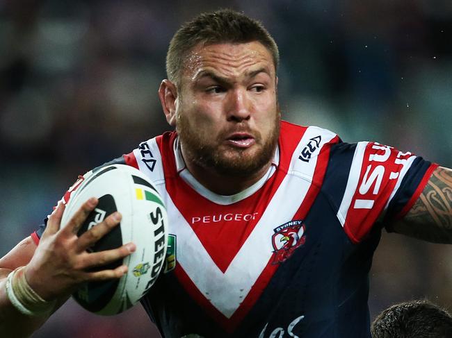 Rooster's Jared Waerea-Hargraves breaks through under pressure from Titan's Mark Minichiello during NRL match Sydney Roosters v Gold Coast Titans at Allianz Stadium. pic. Phil Hillyard