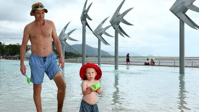 Oleg Suntsov and Gleb Suntsov, 19 months, of Cairns City enjoy their first swim back at the lagoon since its reopening.