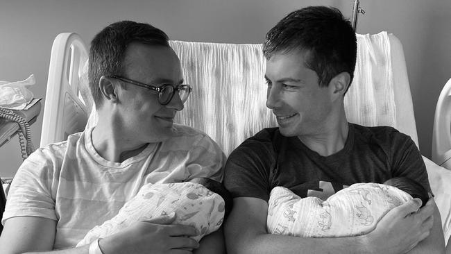 US transport secretary Pete Buttigieg (right) and his husband Chasten introduce their two babies, Penelope Rose and Joseph August in September last year. Picture Twitter/ @peterbuttigieg