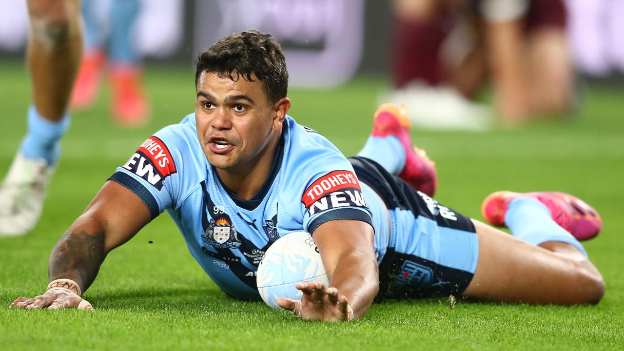 Latrell Mitchell crosses for the first try of the game. (Photo by Chris Hyde/Getty Images)