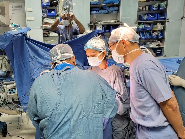 Charlie Teo assisting Indian neurosurgeons.