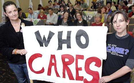 HELPING THE COMMUNITY: Renae Green (left) of Red Inc, and Naomi Worrall of North Coast Community Housing support at the Australian Services Union pay increase rally at the Lismore Workers Club. Picture: David Nielsen