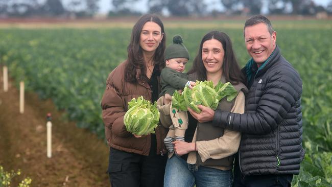 John Said with his daughters Olivia and Raquel, and grandson, Romeo, on their vegeable farm at Werribee South. Picture Yuri Kouzmin