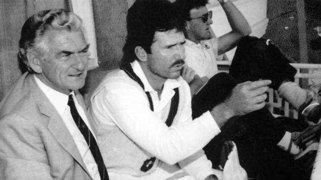 Prime Minister Bob Hawke listens to Australian cricket captain Allan Border during a Test match at Lord's in London in 1989. Picture: AP.