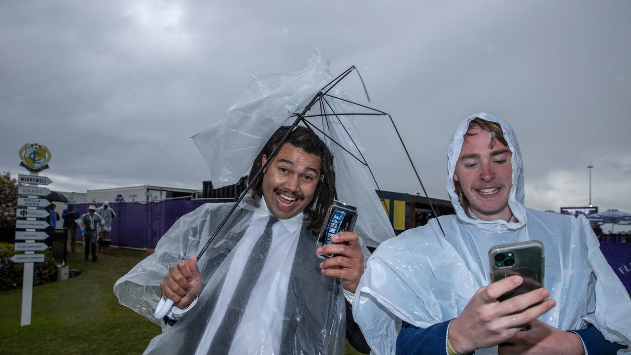 But many were happy regardless of the miserable weather. Picture: Jason Edwards