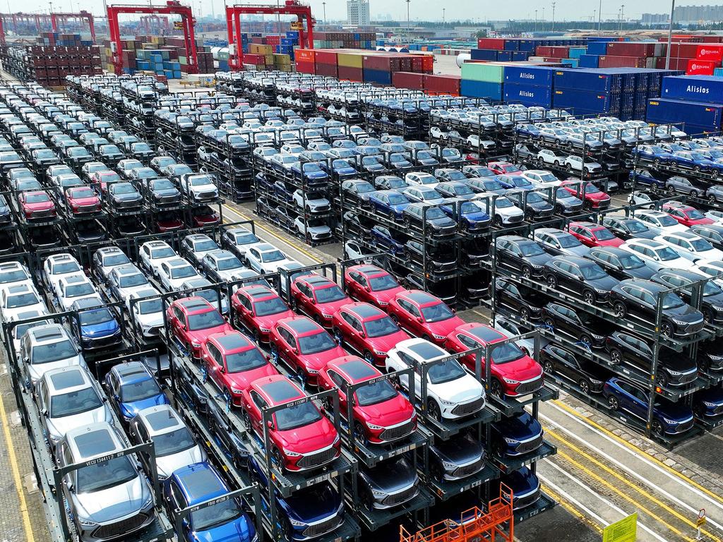 (FILES) This photo taken on September 11, 2023, shows BYD electric cars awaiting to be loaded onto a ship at the international container terminal of Taicang Port at Suzhou Port, in Chinaâs eastern Jiangsu Province. Struggling foreign automakers in China are looking for help from local tech giants to try and stay competitive in the world's biggest electric car market, where shiny smart screens, assisted driving and sophisticated map technology are in high demand. (Photo by AFP) / China OUT / To go with China-economy-auto-technology-EVs, FOCUS by Peter Catterall and Qasim Nauman