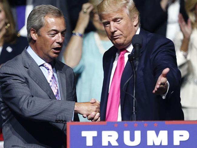 FILE - In this is a Wednesday, Aug. 24, 2016 file photo, Republican presidential candidate Donald Trump, right, welcomes pro-Brexit British politician Nigel Farage, to speak at a campaign rally in Jackson, Miss. Farage says he will attend Donald Trump's inauguration as U.S. president. Farage, one of Trump's strongest U.K. supporters, told Sky News that he had been invited by Mississippi Gov. Phil Bryant. He called the Jan. 20 ceremony in Washington, DC "a great, historic event" and Trump's election "a political revolution." (AP Photo/Gerald Herbert, File)