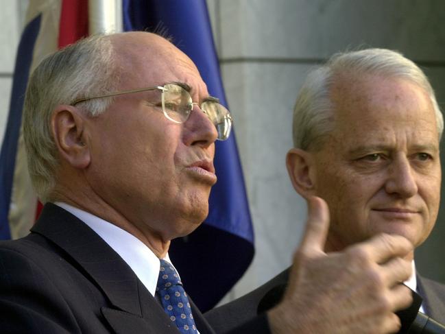 Canberra, May 27, 2004. Prime Minister John Howard and Attorney General Philip Ruddock during a press conference in Canberra today. He announced the Marriage Act will be amended to exclude gay couples and ban same-sex couples from adopting children.  (AAP Image/Alan Porritt) NO ARCHIVING