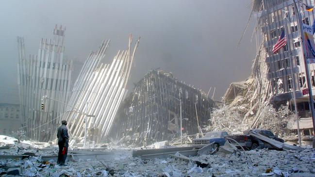 A man stands in the rubble calling out asking if anyone needs help, after the collapse of the first World Trade Center Tower in New York, September 11. Picture: AFP / Doug Kanter