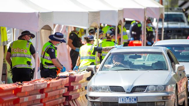 Victoria Police man a checkpoint on the Echuca-Moama bridge between Victoria and New South Wales Picture: Mark Stewart