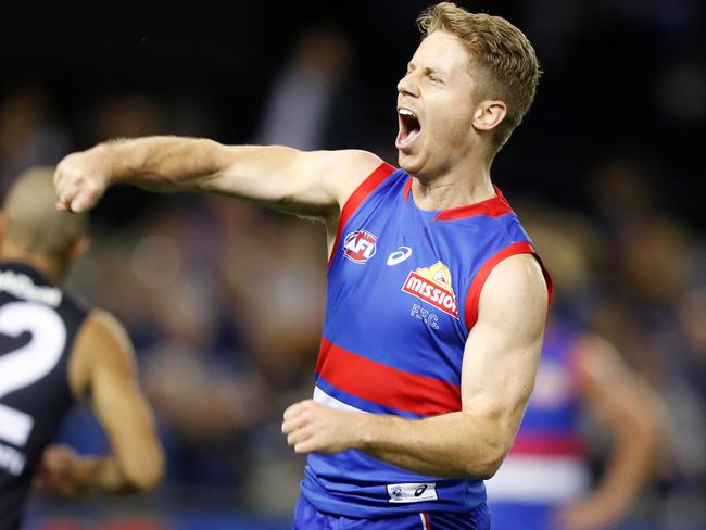 MELBOURNE, AUSTRALIA - MAY 09: Lachie Hunter of the Bulldogs celebrates a goal during the 2021 AFL Round 08 match between the Western Bulldogs and the Carlton Blues at Marvel Stadium on May 09, 2021 in Melbourne, Australia. (Photo by Michael Willson/AFL Photos via Getty Images)