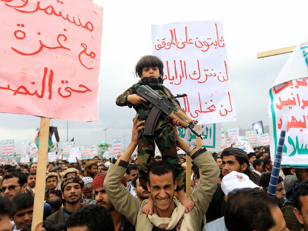 A young boy holds a rifle during a pro-Palestinian and anti-Israel rally in the Huthi-held capital Sanaa. Picture: Mohammed Huwais/AFP