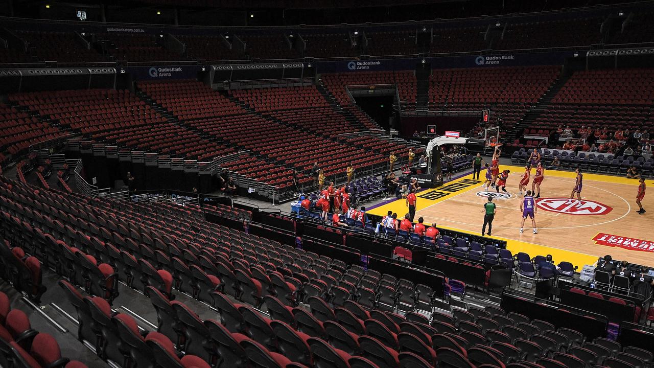 The Kings and Wildcats in action in a mostly empty arena.