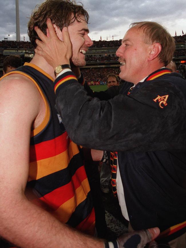 Coach Malcolm Blight celebrates with David Pittman after the 1997 Grand Final win.